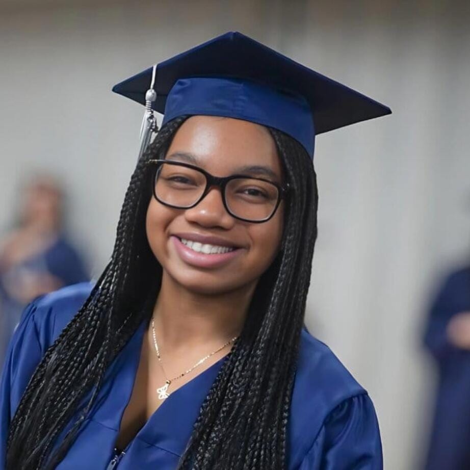 Graduated student smiling at the camera