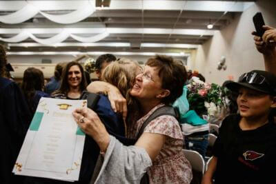 Mother hugging her daughter