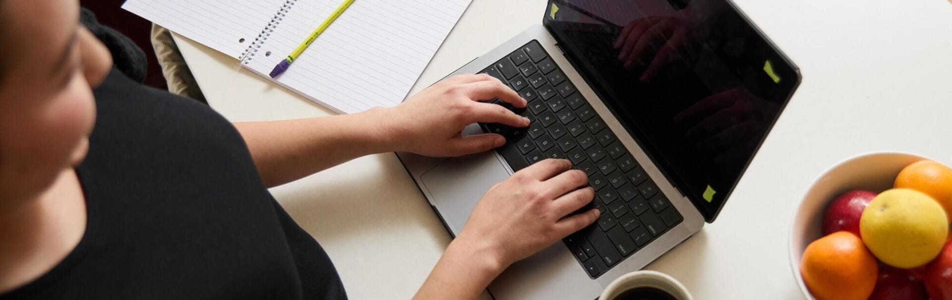 Student working with their computer