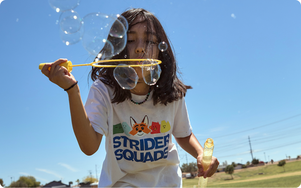 Student playing with bubbles