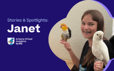 Janet, an AZVA student, smiling while holding two of her parrots.